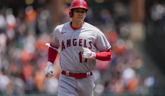 Los Angeles Angels designated hitter Shohei Ohtani runs the bases after hitting a home run against the Baltimore Orioles during the first inning of a baseball game at Oriole Park at Camden Yards, Thursday, May 18, 2023, in Baltimore. (AP Photo/Jess Rapfogel)