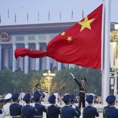 In this photo released by Xinhua News Agency, a member of the Chinese honor guard unfurls the Chinese national flag during a flag raising ceremony to mark the 73rd anniversary of the founding of the People&#x27;s Republic of China held at the Tiananmen Square in Beijing on Oct. 1, 2022. Leaders of the Group of Seven advanced economies are generally united in voicing concern about China. The question is how to translate that worry into action.(Chen Zhonghao/Xinhua via AP, File)