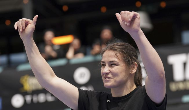 Ireland&#x27;s Katie Taylor waves to supporters during the public workout ahead of her Saturday&#x27;s lightweight championship boxing fight against Chantelle Cameron, at Pembroke Square, Dublin, Ireland, Wednesday May 17, 2023. (Niall Carson/PA via AP)