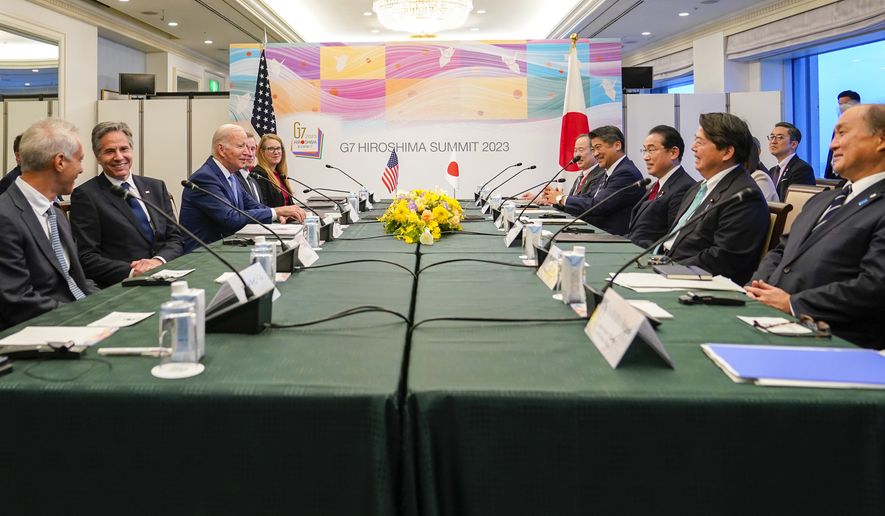 President Joe Biden, third left, reacts with Japan&#x27;s Prime Minister Fumio Kishida, third right, at the start of a bilateral meeting in Hiroshima, Japan, Thursday, May 18, 2023, ahead of the start of the G-7 Summit. (AP Photo/Susan Walsh)