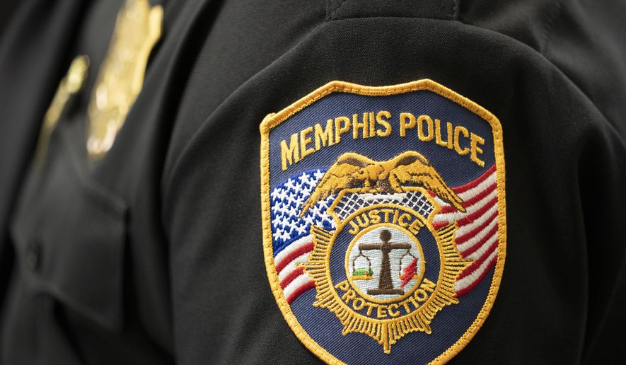 A patch of the Memphis Police Department is seen on Thursday, May 18, 2023, in Nashville, Tenn. Memphis police said a gas station clerk with a firearm thwarted a man who tried to rob the station Monday with a 5-foot-long snake. (AP Photo/George Walker IV)