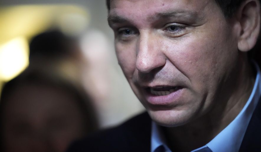 Florida Gov. Ron DeSantis speaks with a customer at the Red Arrow Diner during a visit to Manchester, N.H., Friday, May 19, 2023. (AP Photo/Robert F. Bukaty)
