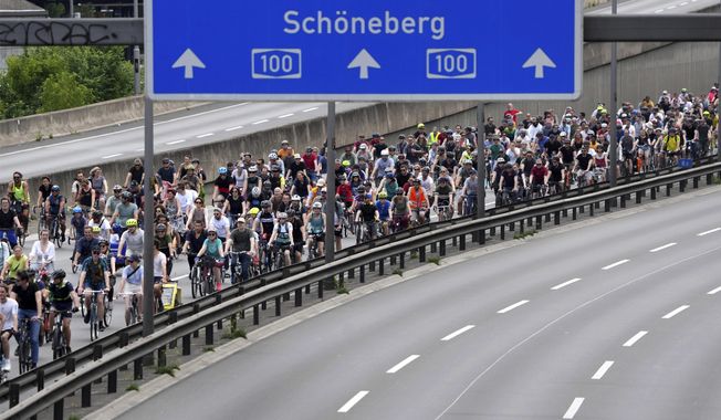 Thousands of cyclists take part in the annual bicycle rally on the closed A100 highway, calling for more space for cyclists in Berlin, Germany, Sunday, June 12, 2022. Back in 1998, 10% of trips in Berlin were by bicycle — a share many cities can only dream about even now. By 2018, that had grown to 18%. That&#x27;s in part because of Berlin’s configuration as a city of many neighborhood centers, with more people living close to where they work and shop. Cycling jumped 22% in 2020, then declined in 2021 but was still 14% higher than in 2019. (AP Photo/Michael Sohn) **FILE**