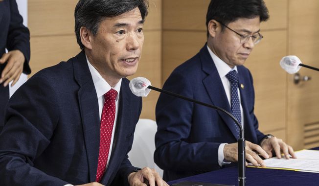 Park Ku-yeon, first vice minister of South Korea&#x27;s Office for Government Policy Coordination, left, speaks next to Yoo Guk-hee, chairperson of Nuclear Safety and Security Commission, right, during a briefing at the government complex in Seoul, South Korea, Friday, May 19, 2023. (Hwang Kwang-mo/Yonhap via AP)