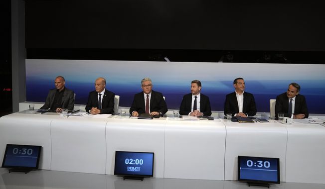 From right to left, New Democracy leader and Prime Minister Kyriakos Mitsotakis, SYRIZA-Progressive Alliance leader Alexis Tsipras, PASOK-Movement for Change (KINAL) leader Nikos Androulakis, Communist Party of Greece Secretary General Dimitris Koutsoubas, Greek Solution leader Kyriakos Velopoulos, and MeRA25 Secretary Yanis Varoufakis wait for the start of debate at the premises of public broadcaster ERT in Athens, Greece, Wednesday, May 10, 2023. Sunday’s Greek parliamentary election looks likely to be a dress rehearsal for a new round of voting in the busy summer tourist season — barring a surprise coalition deal by dissonant opposition parties. (AP Photo/Thanassis Stavrakis)