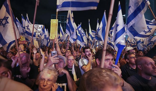 Israelis protest against plans by Prime Minister Benjamin Netanyahu&#x27;s government to overhaul the judicial system, in Tel Aviv, Israel, Saturday, May 20, 2023. (AP Photo/Tsafrir Abayov)