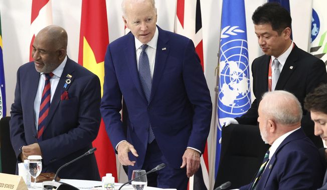 U.S. President Joe Biden, center, attends an outreach session of the leaders of the G7 nations and invited countries, during the G7 Summit in Hiroshima, western Japan, Saturday, May 20, 2023. (Japan Pool via AP)