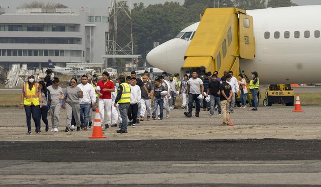 Guatemalan migrants who were deported from the U.S. deplane at La Aurora International Airport in Guatemala City, May 11, 2023. Mexico is flying migrants south away from the U.S. border and busing new arrivals away from its boundary with Guatemala to relieve pressure on its border cities. (AP Photo/Santiago Billy, File)