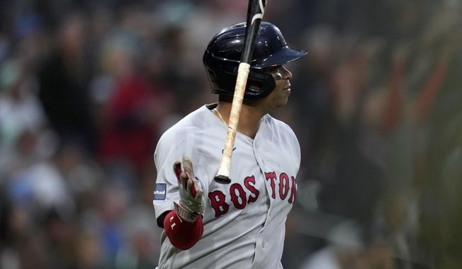Boston Red Sox&#x27;s Rafael Devers tosses his bat after hitting a three-run home run during the third inning of a baseball game against the San Diego Padres, Friday, May 19, 2023, in San Diego. (AP Photo/Gregory Bull)