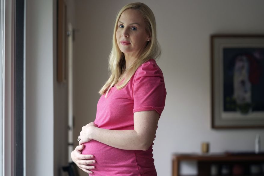 Dr. Austin Dennard poses for a photo at her home in Dallas, Thursday, May 18, 2023. More Texas women who were told they could not end pregnancies with fatal fetal anomalies or that endangered their health are challenging the state's restrictive abortion laws. (AP Photo/LM Otero)