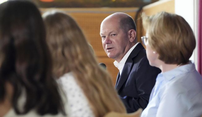 German Chancellor Olaf Scholz visits the Eigenherd School on the occasion of the EU Project Day, in Kleinmachnow, Germany, Monday, May 22, 2023. Scholz on Monday sharply criticized climate protesters for drastic actions such as blocking streets or gluing themselves to famous paintings in museums. “I think it’s completely nutty to somehow stick yourself to a painting or on the street,” Scholz said during a visit at an elementary school in the town of Kleinmachnow outside of Berlin, German news agency dpa reported. (Soeren Stache/dpa via AP)