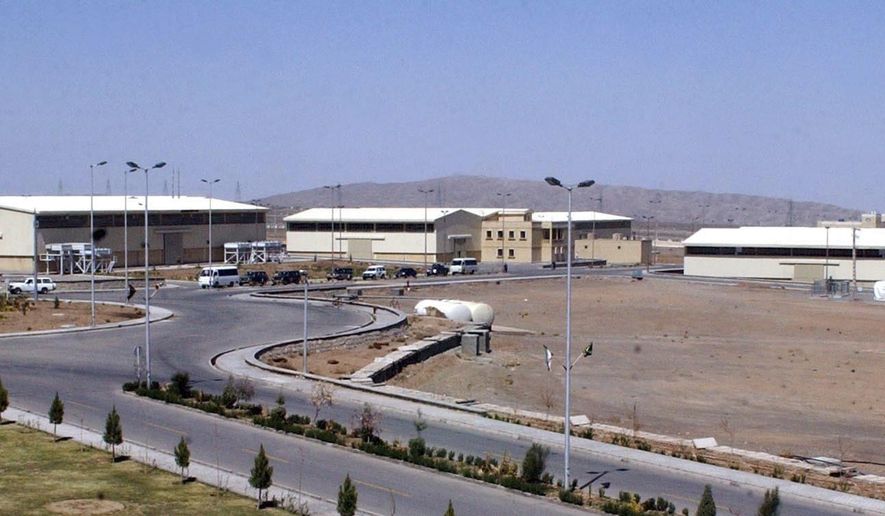 The Natanz uranium enrichment facility buildings, south of Tehran, Iran, is seen in this March 30, 2005, file photo. A new underground facility at the Natanz enrichment site may put centrifuges beyond the range of a massive so-called “bunker buster” bomb earlier developed by the U.S. military, according to experts and satellite photos analyzed by The Associated Press in May 2023. (AP Photo/Vahid Salemi, File)