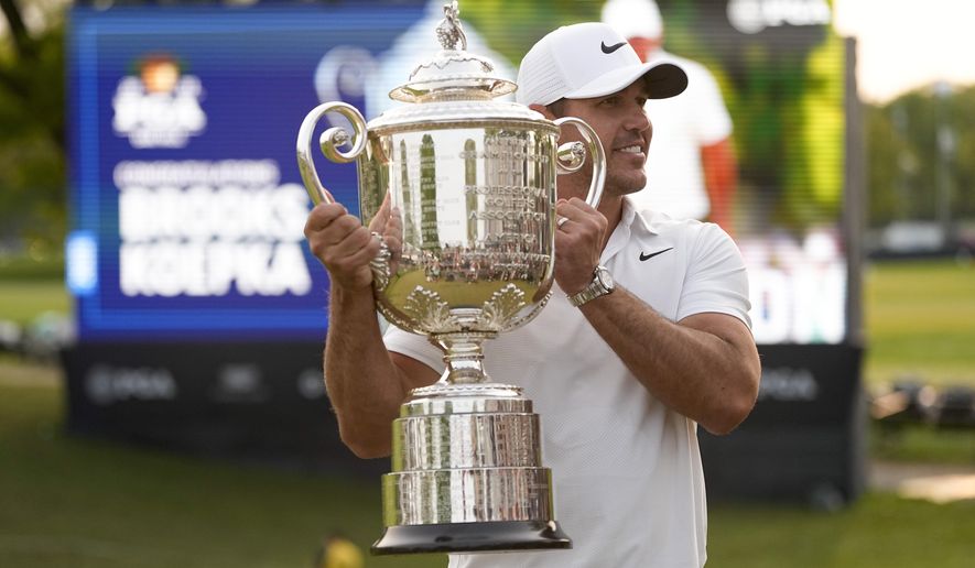 Brooks Koepka holds the Wanamaker trophy after winning the PGA Championship golf tournament at Oak Hill Country Club on Sunday, May 21, 2023, in Pittsford, N.Y. (AP Photo/Abbie Parr)