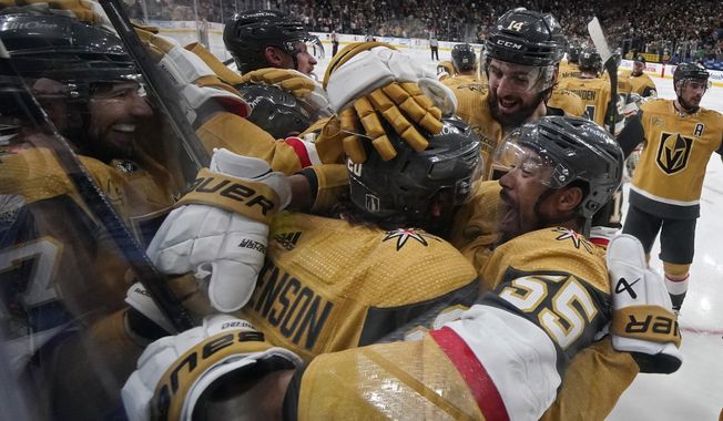 Vegas Golden Knights right wing Keegan Kolesar (55) embraces center Chandler Stephenson (20) after Stephenson scored against the Dallas Stars during overtime of Game 2 of the NHL hockey Stanley Cup Western Conference finals Sunday, May 21, 2023, in Las Vegas. (AP Photo/John Locher) **FILE**