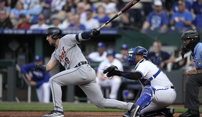 Detroit Tigers&#x27; Matt Vierling hits a two-run single during the first inning of a baseball game against the Kansas City Royals Monday, May 22, 2023, in Kansas City, Mo. (AP Photo/Charlie Riedel)