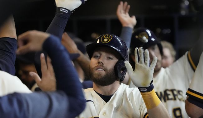 Milwaukee Brewers&#x27; Owen Miller is congratulated after hitting a two-run home run during the eighth inning of a baseball game against the Houston Astros Tuesday, May 23, 2023, in Milwaukee. (AP Photo/Morry Gash)