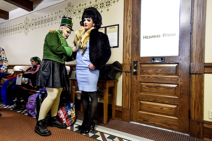 Scenes from a drag show at the state capitol held in protest to a slate of bills aimed at how trans Montanans live on Thursday, April 13, 2023, in Helena, Mont. Montana has become the first state to specifically ban people dressed in drag from reading books to children at public schools and libraries. The law took effect immediately after Republican Gov. Greg Gianforte signed the bill on Monday, May 22, 2023. (Thom Bridge/Independent Record via AP)