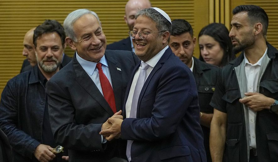 Israeli Prime Minister Benjamin Netanyahu and Israel's National Security Minister Itamar Ben-Gvir smile before Netanyahu's statement in the Knesset, Israel's parliament in Jerusalem, Tuesday, May 23, 2023. (AP Photo/Ohad Zwigenberg)
