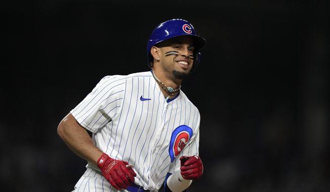 Chicago Cubs&#x27; Christopher Morel smiles as he runs the after hitting a home run off New York Mets relief pitcher Stephen Nogosek during the seventh inning of a baseball game Tuesday, May 23, 2023, in Chicago. (AP Photo/Charles Rex Arbogast)