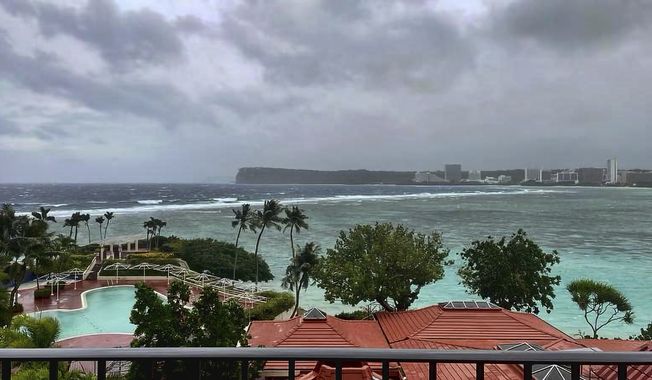 This photo provided by the U.S. Coast Guard overlooking Noverlooking Tumon Bay in Guam, as Super Typhoon Mawar closes in on Tuesday, May 23, 2023. Residents of Guam are stockpiling supplies, battening down windows and abandoning wood and tin homes for emergency shelters as Super Typhoon Mawar bears down as the strongest storm to approach the U.S. Pacific territory in decades. ( Lt. Junior Grade Drew Lovullo/US Coast Guard via AP)