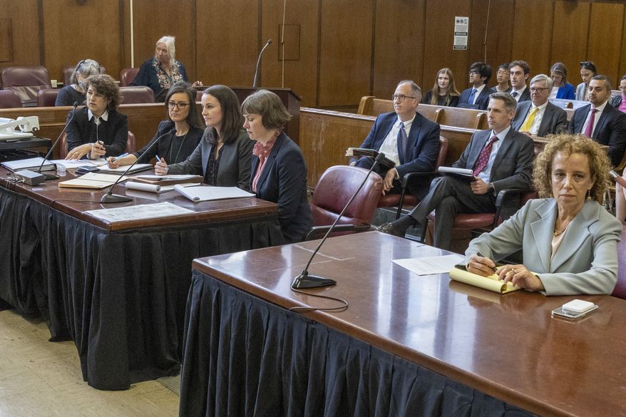 Former President Trump's lawyer Susan Necheles, right, and prosecutor Catherine McCaw, second from right, are seen in Manhattan Supreme court before the start of a hearing, Tuesday, May 23, 2023, in New York. Trump made video appearance in his criminal case on Tuesday. He has pleaded not guilty on April 4 to 34 felony counts of falsifying business records related to payments his company made to his former lawyer, Michael Cohen. (Daniel McKnight/New York Post via AP, Pool)