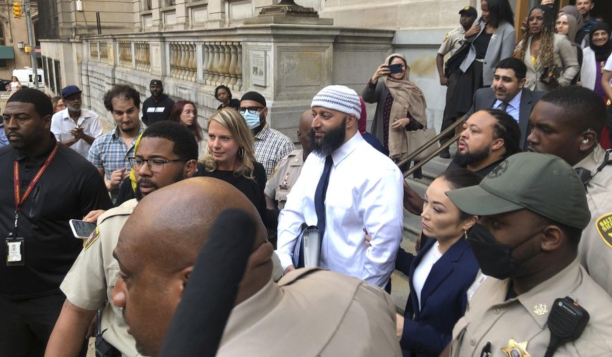 Adnan Syed, center, leaves the Elijah E. Cummings Courthouse on Sept. 19, 2022, in Baltimore. Syed’s lawyer has asked Maryland’s highest court Wednesday, May 24, 2023, to overturn a lower court’s ruling that reinstated his murder conviction from more than two decades ago - after he was freed last year in a legal case that gained international attention from the hit podcast “Serial.” (AP Photo/Brian Witte, File)