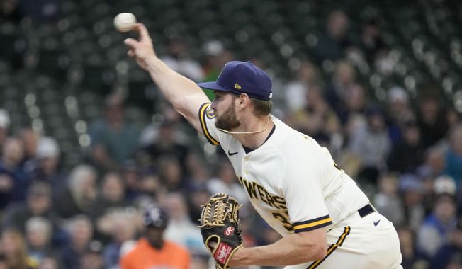 Milwaukee Brewers starting pitcher Adrian Houser throws during the first inning of a baseball game against the Houston Astros Wednesday, May 24, 2023, in Milwaukee. (AP Photo/Morry Gash)