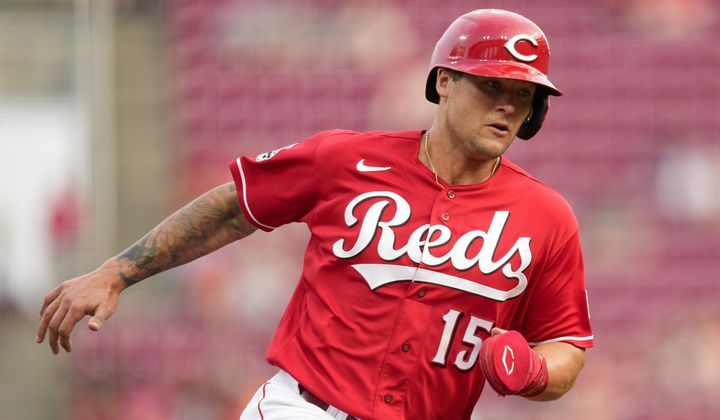 Cincinnati Reds&#x27; Nick Senzel (15) rounds the bases and scores on a Kevin Newman single in the third inning of a baseball game against the St. Louis Cardinals in Cincinnati, Wednesday, May 24, 2023. (AP Photo/Jeff Dean)