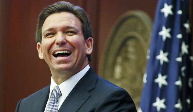 Florida Gov. Ron DeSantis reacts to applause as he gives his State of the State address during a joint session of the Senate and House of Representatives March 7, 2023, at the Capitol in Tallahassee, Fla. (AP Photo/Phil Sears, File)