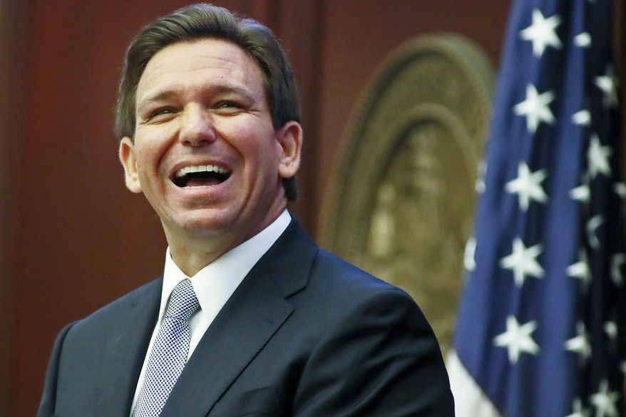 Florida Gov. Ron DeSantis reacts to applause as he gives his State of the State address during a joint session of the Senate and House of Representatives March 7, 2023, at the Capitol in Tallahassee, Fla. (AP Photo/Phil Sears, File)