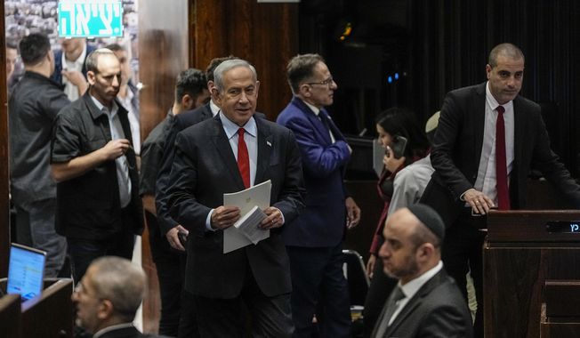 Israeli Prime Minister Benjamin Netanyahu enters the Knesset, Israel&#x27;s parliament in Jerusalem, Tuesday, May 23, 2023. (AP Photo/Ohad Zwigenberg)
