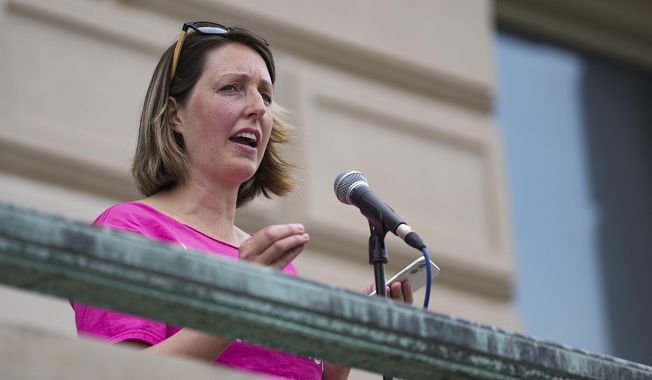 Dr. Caitlin Bernard, a reproductive health care provider, speaks during an abortion rights rally on June 25, 2022, at the Indiana Statehouse in Indianapolis. An Indiana board is set to hear allegations Thursday, May 25, 2023, that Bernard, an Indianapolis doctor should face disciplinary action after she spoke publicly about providing an abortion to a 10-year-old rape victim from neighboring Ohio. (Jenna Watson/The Indianapolis Star via AP, File)