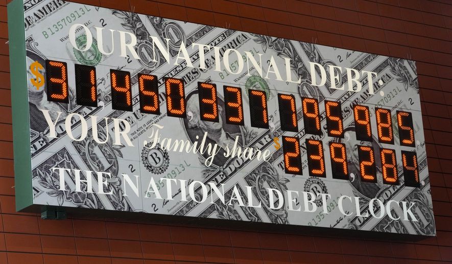 The national debt clock is seen in midtown Manhattan, Thursday, May 25, 2023. Both President Joe Biden and House Speaker Kevin McCarthy are speaking hopefully of the likelihood of an agreement to raise the government&#x27;s debt limit and avert an economically chaotic federal default. (AP Photo/Mary Altaffer)