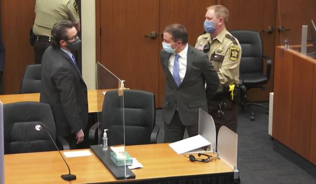 Former Minneapolis Police Officer Derek Chauvin, center, is taken into custody as his attorney, Eric Nelson, left, looks on after the verdicts were read at Chauvin&#x27;s trial for the 2020 death of George Floyd, at the Hennepin County Courthouse in Minneapolis, April 20, 2021. The third anniversary of Floyd’s murder is Thursday, May 25, 2023. (Court TV via AP, Pool, File)
