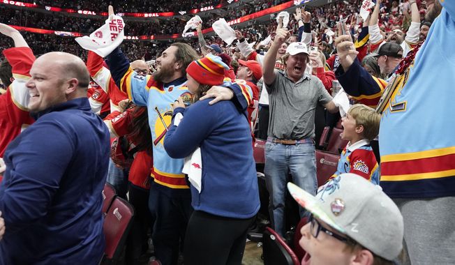 Fans react after Florida Panthers left wing Matthew Tkachuk scored a power-play goal with 4.9 seconds left in the third period of Game 4 of the NHL hockey Stanley Cup Eastern Conference finals against the Carolina Hurricanes, Wednesday, May 24, 2023, in Sunrise, Fla. (AP Photo/Wilfredo Lee)