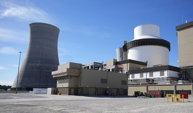 Unit 3’s reactor and cooling tower stand at Georgia Power Co.&#x27;s Plant Vogtle nuclear power plant on Jan. 20, 2023, in Waynesboro, Ga. Company officials announced Wednesday, May 24, 2023, that Unit 3, one of two new reactors at the site, would reach full power in coming days, after years of delays and billions in cost overruns. (AP Photo/John Bazemore, File)