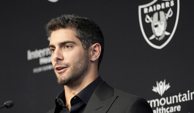 Las Vegas Raiders quarterback Jimmy Garoppolo takes questions during an NFL football news conference, Friday, March 17, 2023, in Henderson, Nev. The new Raiders quarterback is not taking part in organized team activities because of a lingering foot injury. Coach Josh McDaniels said Thursday, May 25, 2023, that Garoppolo could be held out until July when training camp begins. (AP Photo/John Locher, File)