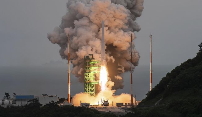 In this photo released by the Korea Aerospace Research Institute, the Nuri rocket lifts off from a launch pad at the Naro Space Center in Goheung, South Korea, Thursday, May 25, 2023. South Korea launched the commercial-grade satellite Thursday for the first time as part of its growing space development program, as rival North Korea is pushing to place its first military spy satellite into orbit. (Korea Aerospace Research Institute via AP)