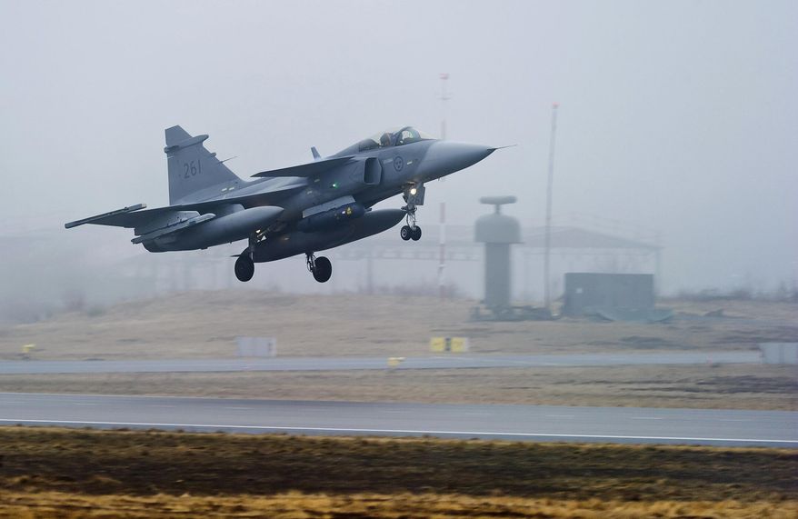 A Swedish Air Force JAS 39 Gripen fighter aircraft takes off from the Blekinge Wing F17, based in Kallinge, southern Sweden, Saturday April 2, 2011. Sweden's Defense Minister Pal Jonsson said on Thursday, May 25, 2023, that the Nordic country is considering to let Ukrainian pilots test its JAS 39 Gripen fighter jets. (Patric Soderstrom/TT News Agency via AP) **FILE**