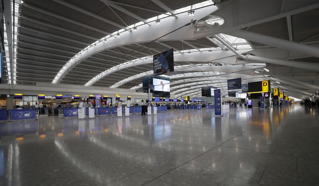 Terminal 5 at Heathrow Airport in London, which handles British Airways flights, stands virtually empty of passengers as staff standby to help during a British Airways pilots&#x27; strike, Monday, Sept. 9, 2019. British Airways cancelled dozens of flights on Friday, May 26, 2023, due to computer problems, disrupting the plans of thousands of travelers at the start of a busy holiday weekend. (AP Photo/Matt Dunham, File)