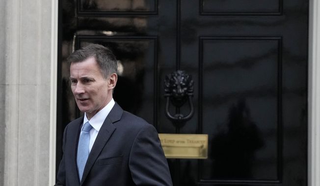 Britain&#x27;s Chancellor of the Exchequer Jeremy Hunt leaves 10 Downing Street in London, on Jan. 18, 2023. Britain&#x27;s Treasury chief said he would be prepared to see the U.K. economy slip back into recession if further interest rate hikes are necessary to bring down inflation. (AP Photo/ Frank Augstein, File)