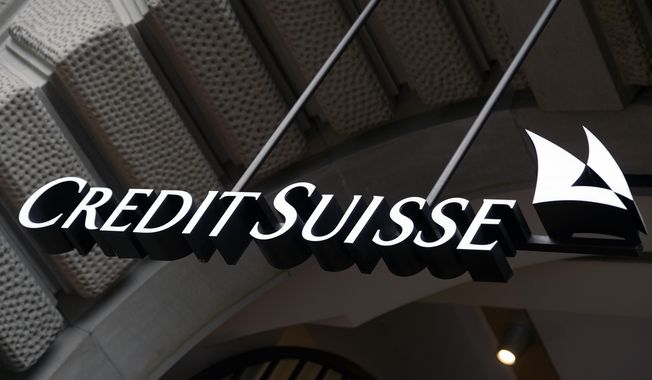 The logo of the Swiss bank Credit Suisse is seen on a building in Zurich, Switzerland, Oct. 21, 2015. A Singapore court ruled Friday, May 26, 2023, that Credit Suisse owes billionaire and former Georgian Prime Minister Bidzina Ivanishvili hundreds of millions of dollars for failing to protect his money in a trust pilfered by a manager, the latest scandal for the Swiss bank whose years of problems led to its takeover by a rival. (Walter Bieri/Keystone via AP, File)