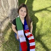 In this undated photo, Naomi Peña Villasano poses with a sash of both the Mexican and American flags that her school district barred her from wearing for her high school graduation ceremony. After Peña Villasano sued the district alleging that it violated her right to free speech, a federal judge in Colorado is weighing whether to let Peña Villasano wear the sash for graduation Saturday, May 27, 2023. (Daisy Jasmin Estrada Borja via AP)