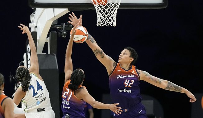 Phoenix Mercury forward Brianna Turner (21) and center Brittney Griner (42) defend against Minnesota Lynx forward Napheesa Collier (24) during the second half of a WNBA basketball game Thursday, May 25, 2023, in Phoenix. (AP Photo/Ross D. Franklin)