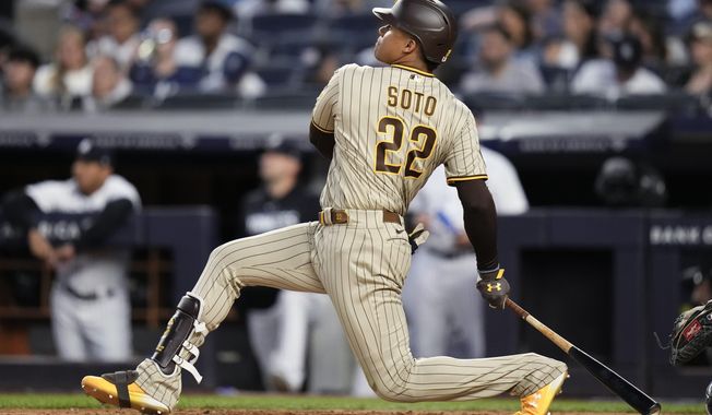 San Diego Padres&#x27; Juan Soto watches his two-run home run during the fifth inning of the team&#x27;s baseball game against the New York Yankees on Friday, May 26, 2023, in New York. (AP Photo/Frank Franklin II)