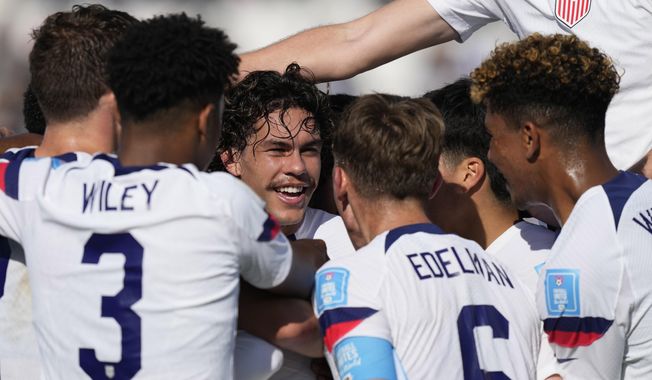 Cade Cowell of the United States, center, celebrates with his teammates after scoring his side&#x27;s first goal during a FIFA U-20 World Cup Group B soccer match against Slovakia at the San Juan stadium in San Juan, Argentina, Friday, May 26, 2023. (AP Photo/Natacha Pisarenko)