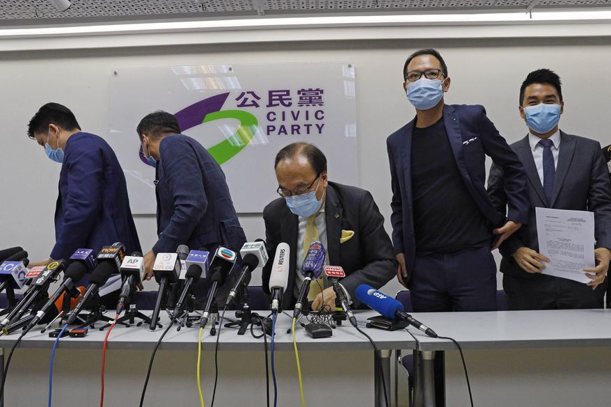 From right, pro-democracy Civic Party members, Cheng Tat-hung, Dennis Kwok, Alan Leong, Alvin Yeung and Jeremy Tam leave a news conference after being disqualified for a legislative election in Hong Kong, July 30, 2020. Hong Kong pro-democracy political party Civic Party on Saturday, May 27, 2023 voted to dissolve, after none of its members filed nominations to take up executive committee positions. (AP Photo/Kin Cheung, File)