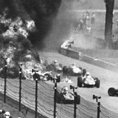 Drivers weave through blazing wreckage after a crash on the second lap of the Indianapolis 500 auto race at Indianapolis Motor Speedway in Indianapolis on May 30, 1964. Eddie Sachs and Dave MacDonald were killed in the wreckage. The fiery crash that took the lives of Sachs and MacDonald led to more firefighters being hired for races. (AP Photo/File)