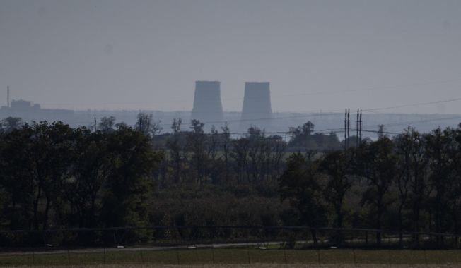 Zaporizhzhia nuclear power plant is seen from around twenty kilometers away in an area in the Dnipropetrovsk region, Ukraine, Monday, Oct. 17, 2022. A statement released Friday, May 26, 2023, by the intelligence directorate of Ukraine&#x27;s Defense Ministry claimed that Russian forces would strike the Zaporizhzhia nuclear power plant, the biggest in Europe, and then report a radioactive leak in order to trigger an international probe that would pause the hostilities and give the Russian forces the respite they need to regroup ahead of the counteroffensive. (AP Photo/Leo Correa, File)
