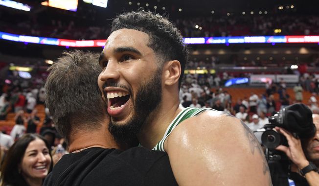 Boston Celtics forward Jayson Tatum celebrates after the Celtics beat the Miami Heat 104-103 during Game 6 of the NBA basketball Eastern Conference finals, Saturday, May 27, 2023, in Miami. (AP Photo/Michael Laughlin) **FILE**